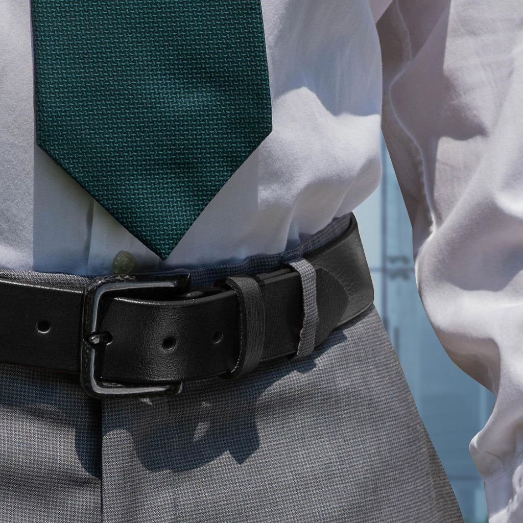 Image of person wearing The Specialist Black leather Belt with black carbon fiber buckle.  