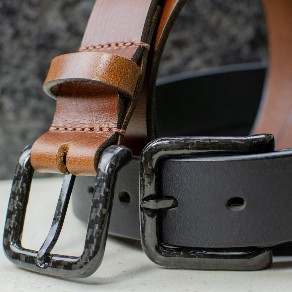 Image of 2 black carbon fiber buckles sewn onto 1 black and 1 brown leather strap. USA Made