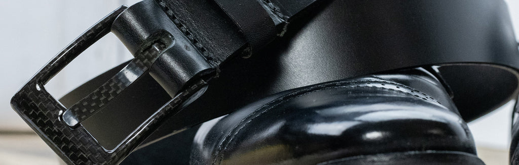 Image of The Classified Black Leather Belt. Black carbon fiber square buckle sewn onto black full grain leather strap.