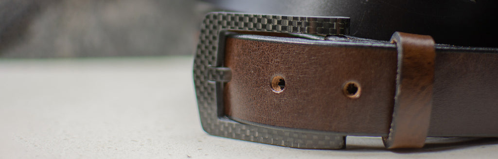 Image of The Stealth Brown leather dress belt. Brown leather belt with a black carbon fiber buckle.