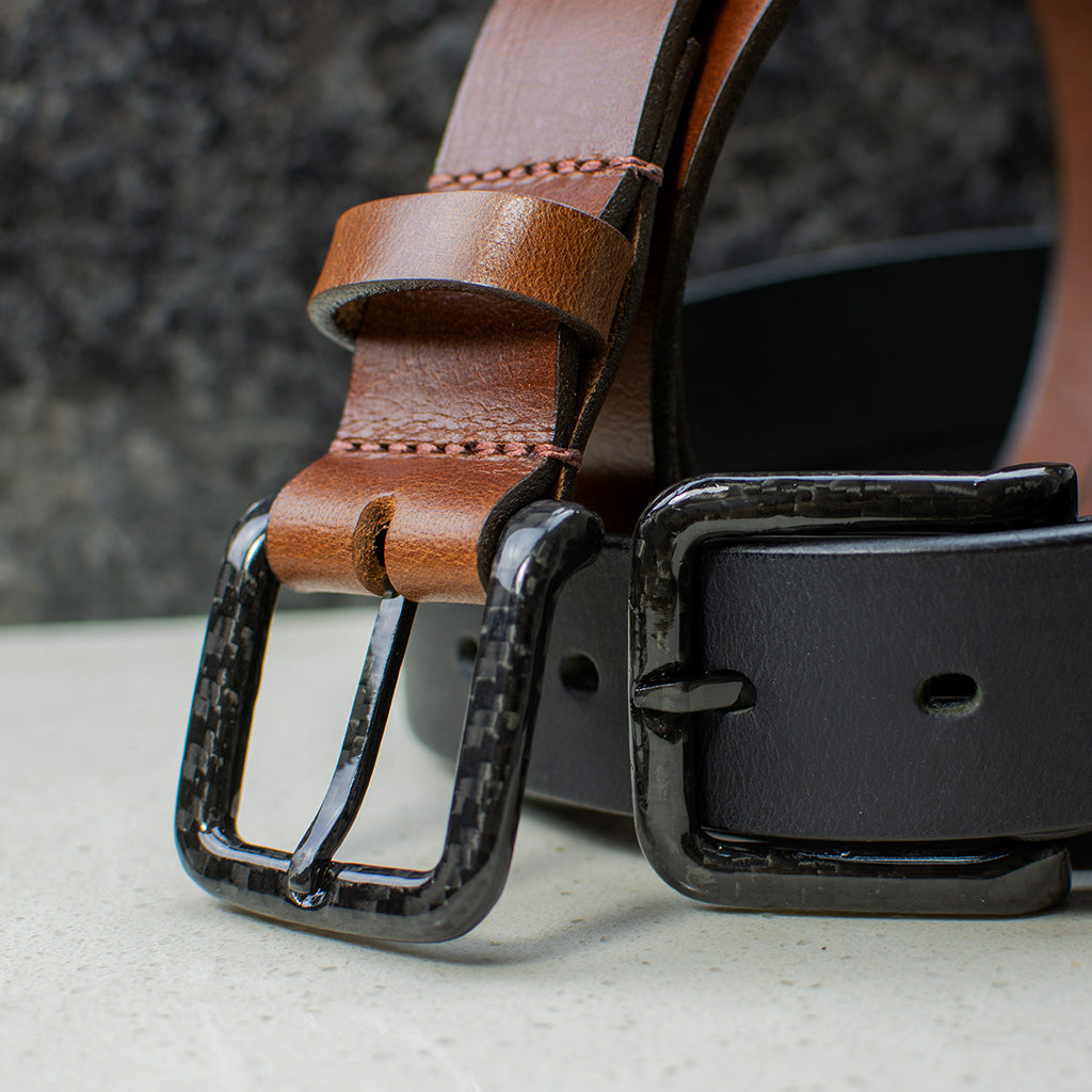 Image of The Specialist Belt Set. One black and one brown strapped belts with carbon fiber buckle.